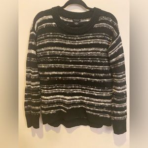 M. CALVIN KLEIN. Black and white sweater.